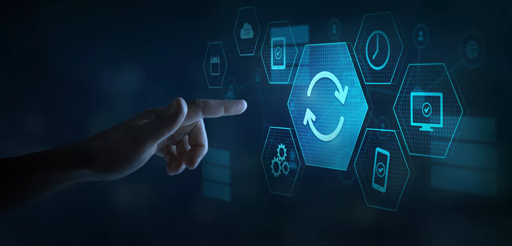 A hand points to a digital hexagonal icon with circular arrows, symbolizing synchronization. Surrounding icons depict cloud, computer, and smartphone, set on a dark blue tech-themed background.